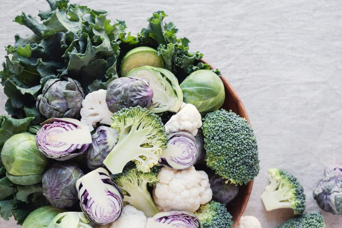 Assortment of sulfur-rich foods including broccoli, Brussels spouts, and cabbage.