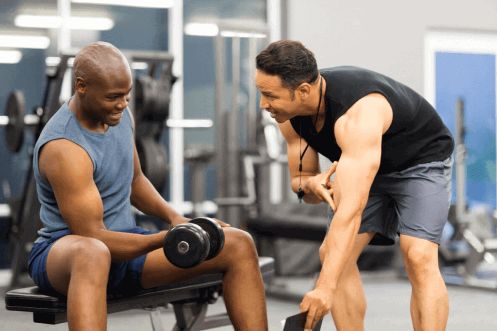 two men in the gym lifting weights