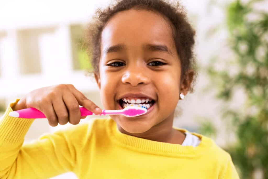 child brushing their teeth