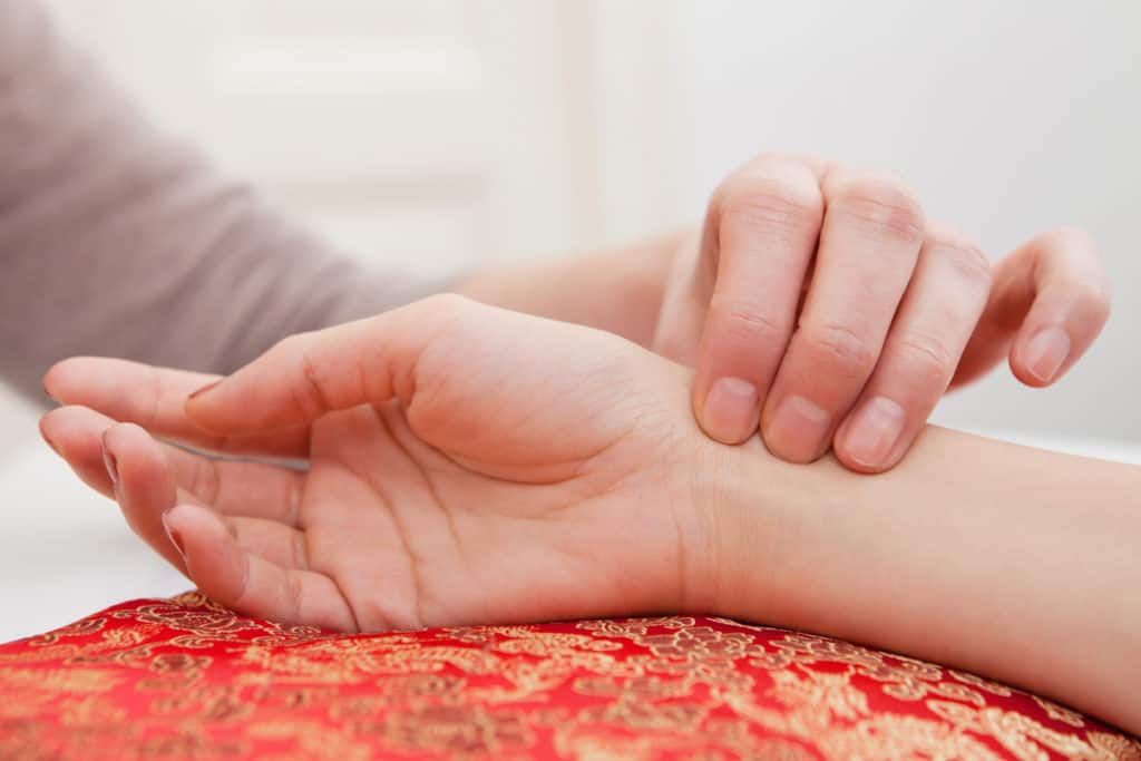 Person getting their pulse taken