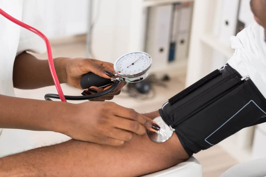 Person getting their blood pressure taken