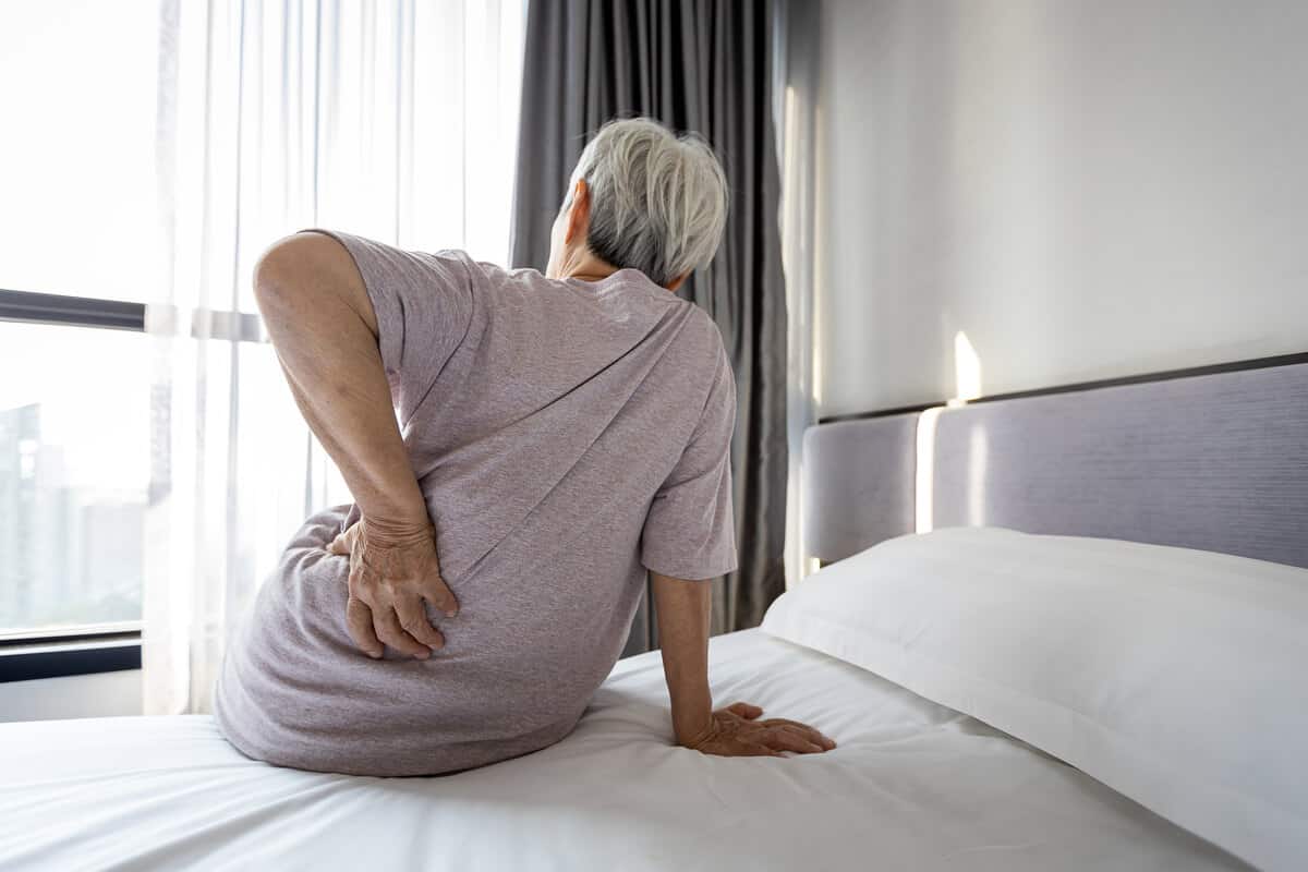 Woman holding back