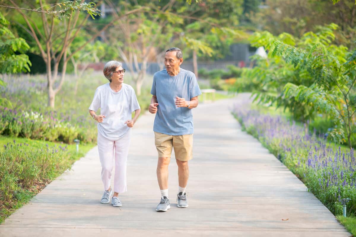 two elderly people going for a walk