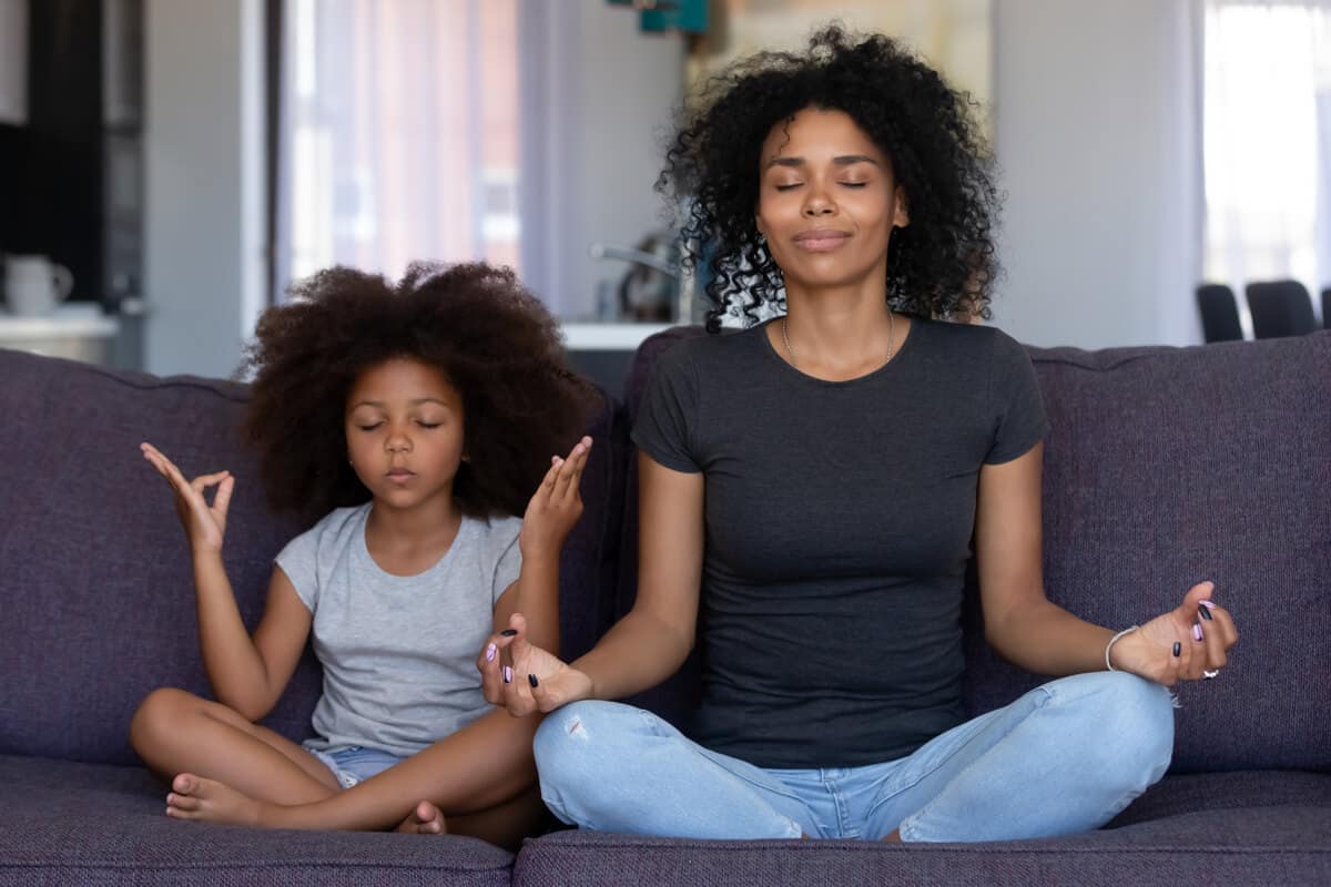 Woman and child meditating 