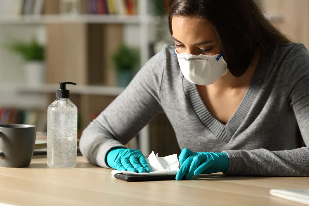 Woman cleaning her phone.