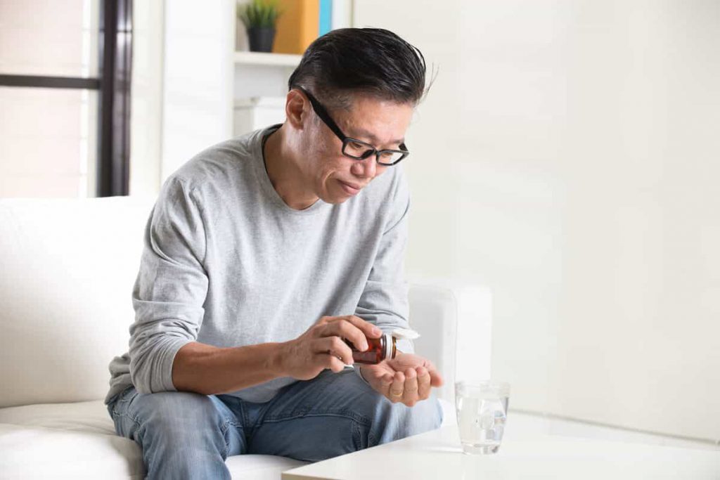 Man taking supplements