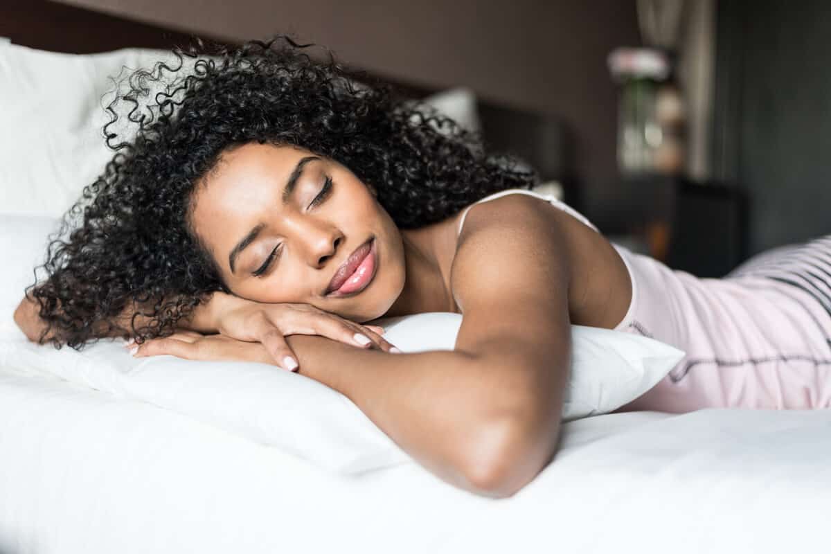 Woman resting her head on a pillow