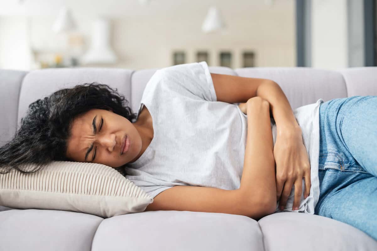 Woman holding abdominals 