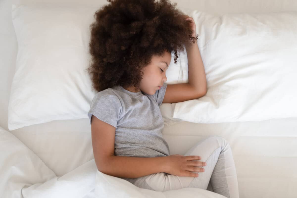 Child lying in bed sleeping