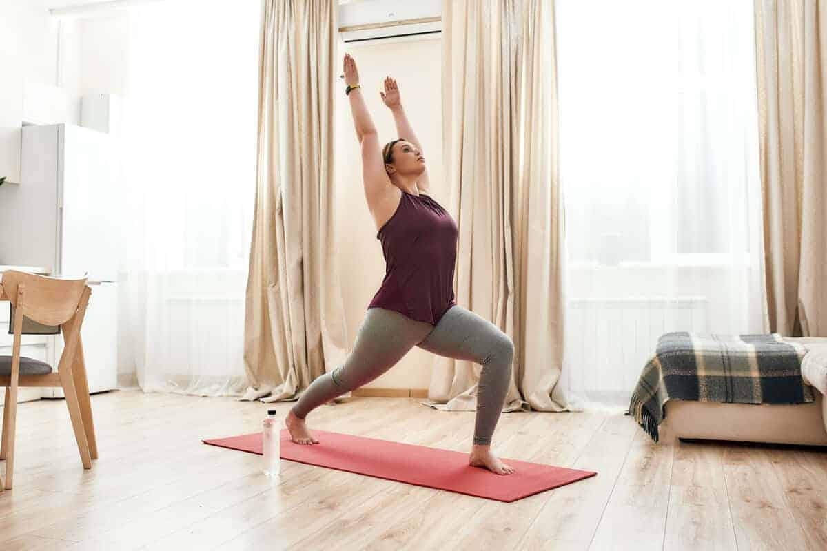 how to improve digestive health woman doing yoga