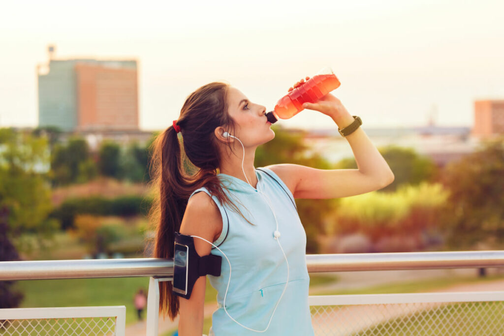woman drinking electrolytes