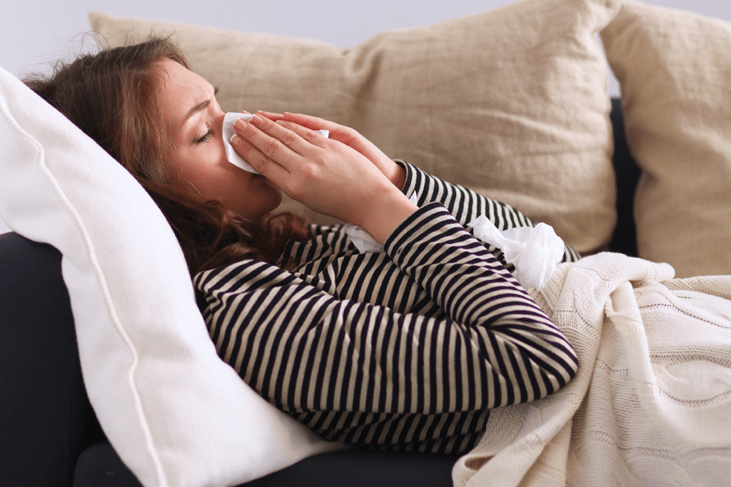 stress affecting the body woman sneezing