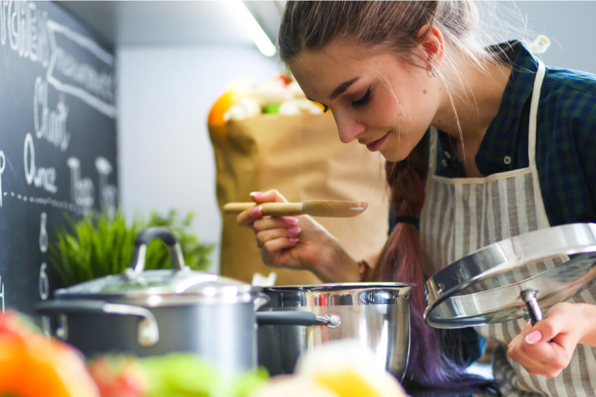 nordic diet woman cooking an organic home cooked meal