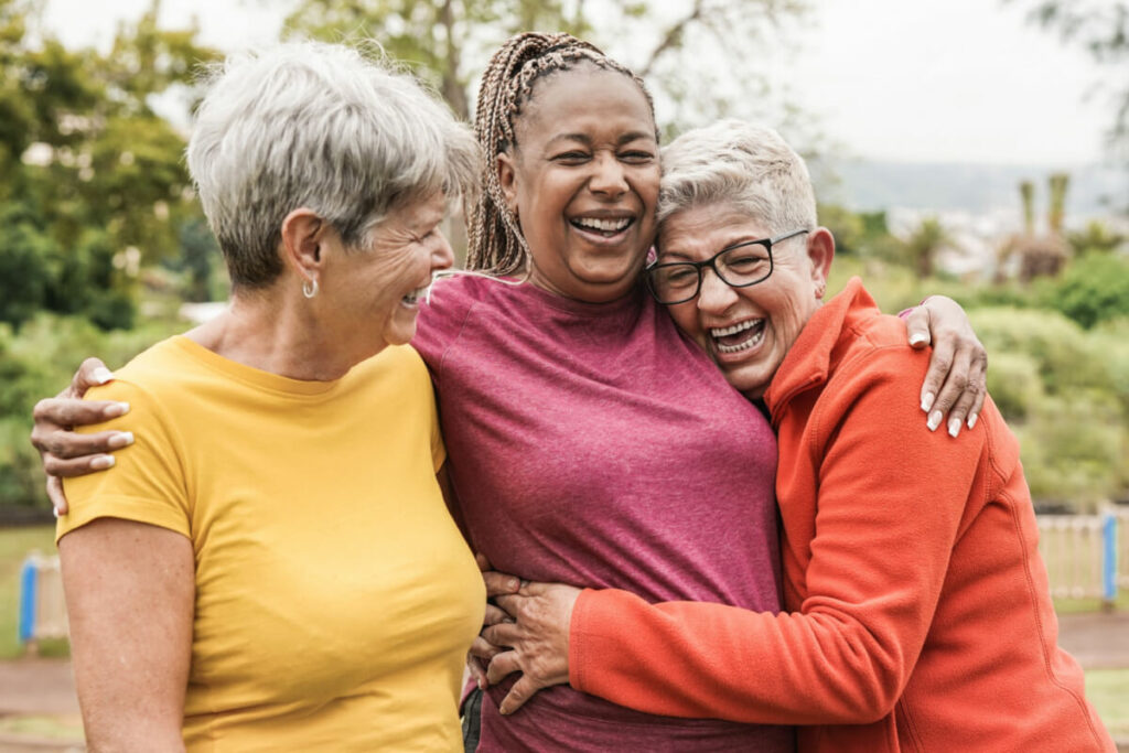 4 people walking and talking together