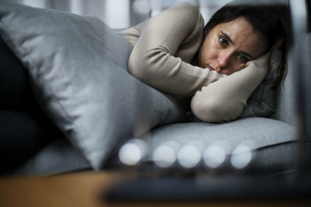 woman lying on a couch