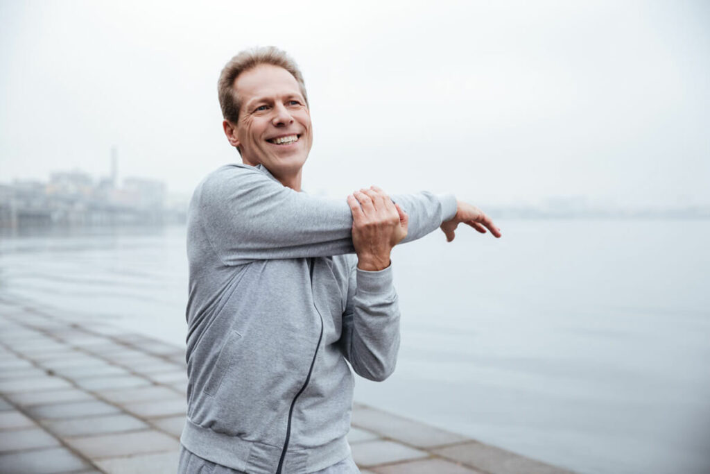 man stretching his arm