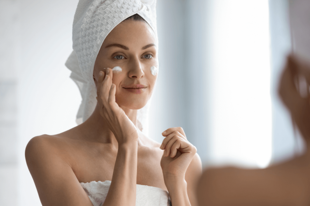 woman applying face cream