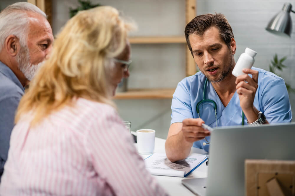 doctor showing patients how to read a supplement label
