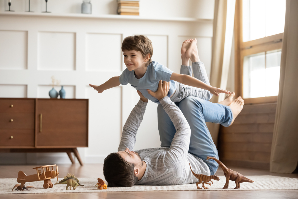 man lifting child up