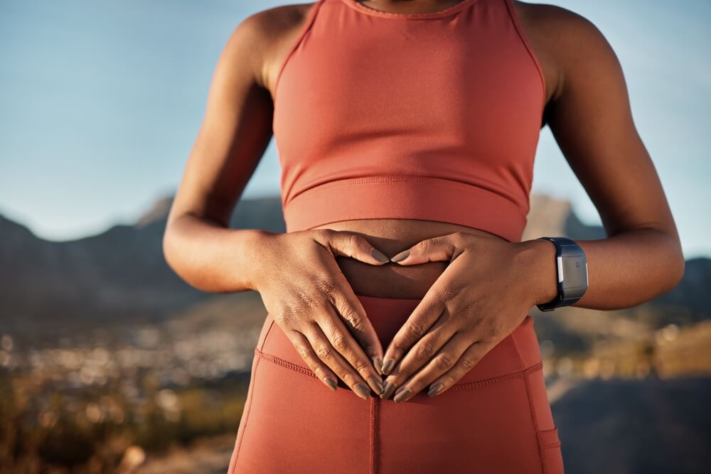 woman holding her stomach