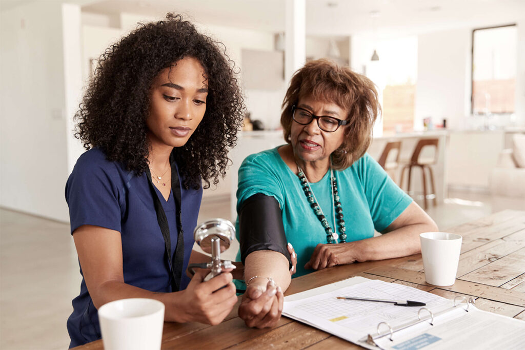 practitioner taking a patients blood pressure