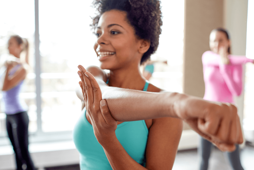 woman doing stretching exercises to reduce their risk of dementia