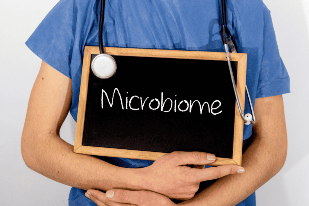 provider holding a microbiome sign